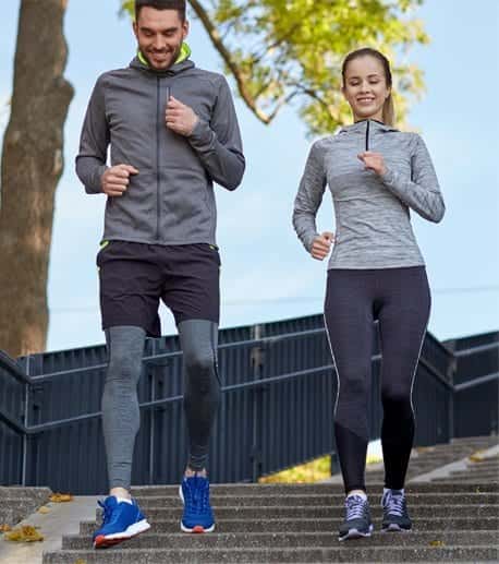 man & women running down stairs